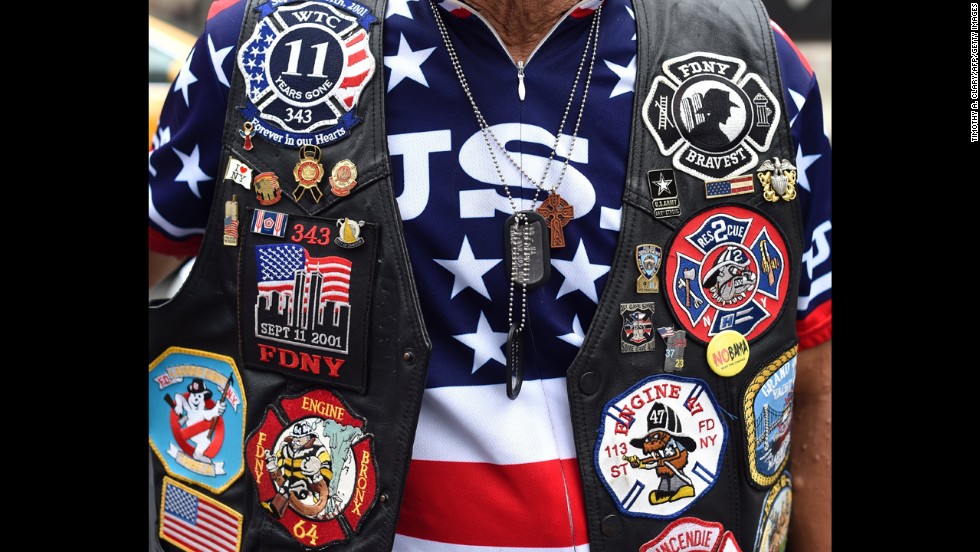 A man stands across the street from the National September 11 Memorial &amp;amp; Museum in New York.