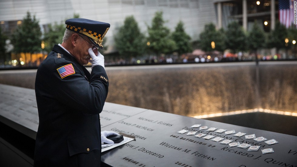 Sam Pulia, the mayor of Westchester, Illinois, and a former police officer of the same town, mourns over the name of his cousin, New York firefighter Thomas Anthony Casoria, who was killed on 9/11.