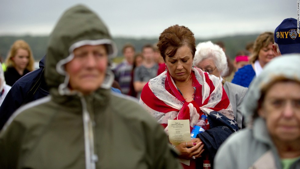 A woman bows her head in prayer in Shanksville, where United Airlines Flight 93 went down.