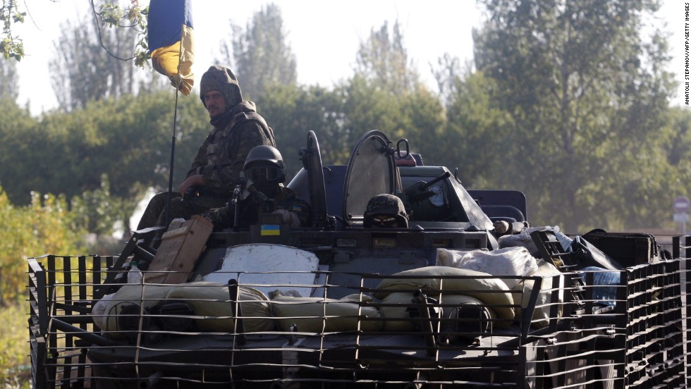 Ukrainian soldiers ride on an armored vehicle near Kramatorsk, Ukraine, on September 13.