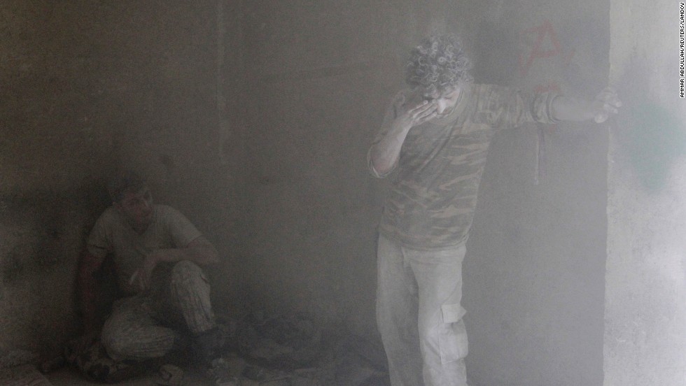 Free Syrian Army fighters rest inside a damaged room in Aleppo on Tuesday, September 16, during what activists said were clashes with forces loyal to al-Assad.