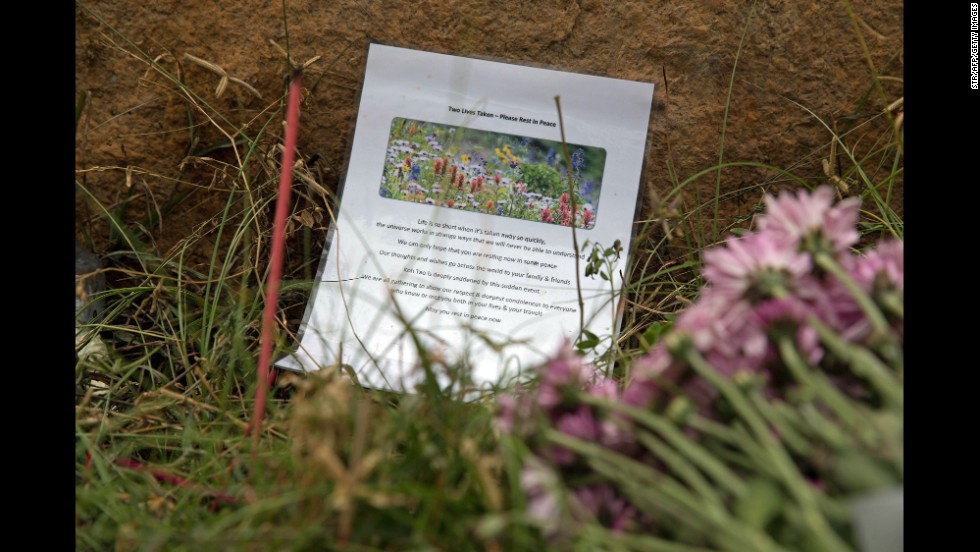 A tribute and flowers sit near the spot where the couple was found.