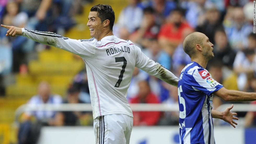 Cristiano Ronaldo celebrates after scoring one of Real Madrid&#39;s eight goals against Deportivo la Coruna at the Municipal de Riazor stadium. 