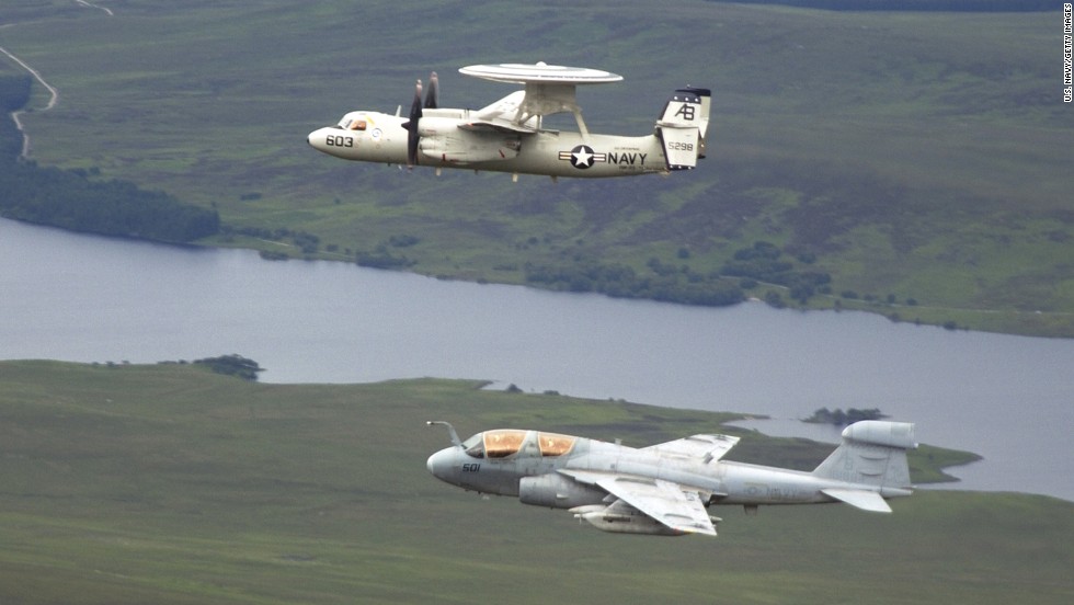 EA-6B Prowlers are among the U.S. aircraft that took off from the USS George H.W. Bush during attacks on ISIS. The Prowler is used to support attack aircraft by jamming enemy radar and communications and obtaining tactical intelligence. Here, a Prowler -- seen at bottom -- flies in formation with an E-2C Hawkeye in June 2004.