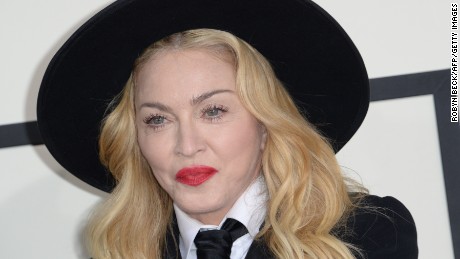 Performer Madonna poses on the red carpet  during the 56th Grammy Awards at the Staples Center in Los Angeles, California, January 26, 2014. AFP PHOTO ROBYN BECK        (Photo credit should read )