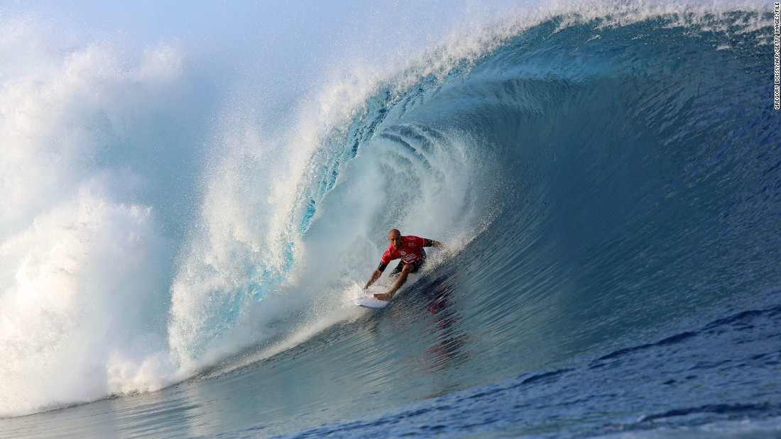 Slater rides a wave on August 18, 2014, during the 14th edition of the Billabong Pro Tahiti surf event in Teahupoo, Tahiti.