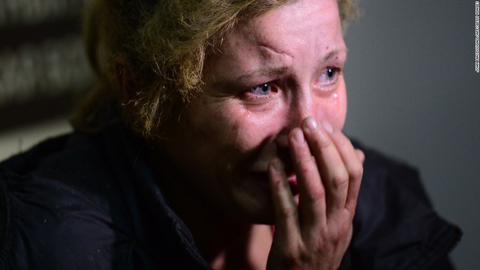 A woman injured at a bus station cries at a Donetsk hospital on October 1.