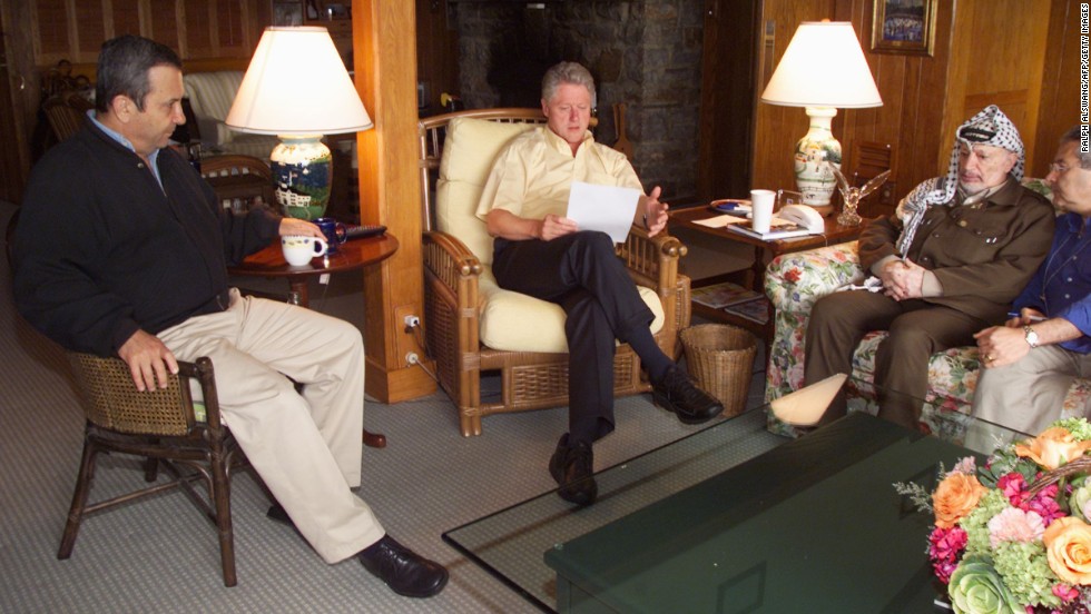 Clinton meets with Israeli Prime Minister Ehud Barak, left, and Palestinian Authority Chairman Yasser Arafat at Maryland&#39;s Camp David in July 2000. It was at the end of a Mideast peace summit. The talks ended without an agreement.  