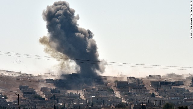 Smoke rises from the Syrian town of Ain al-Arab, known as Kobani by the Kurds, on the Turkish-Syrian border in the southeastern town of Suruc, Sanliurfa province, on October 6, 2014.