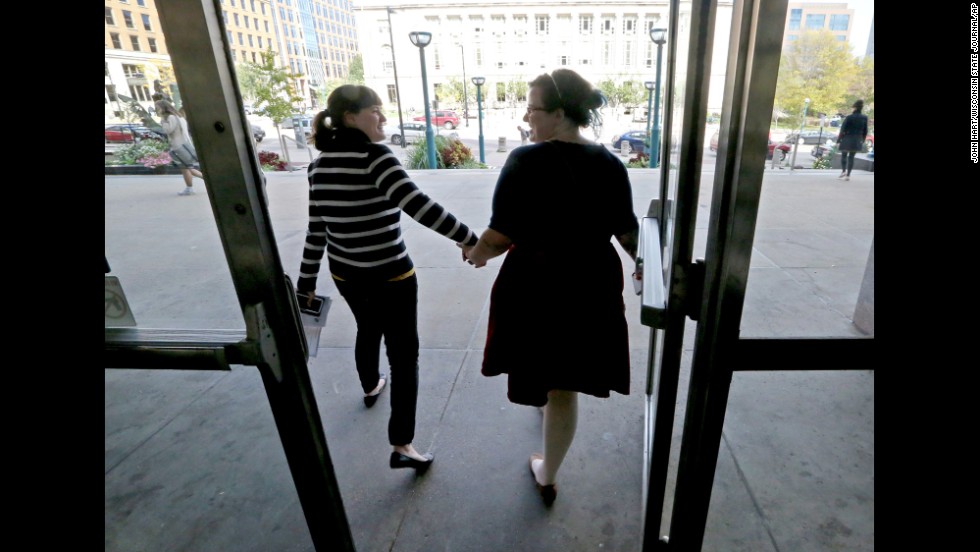 Abbi Huber, left, and Talia Frolkis exit the City County Building in Madison, Wisconsin, after applying for a marriage license on October 6, 2014.