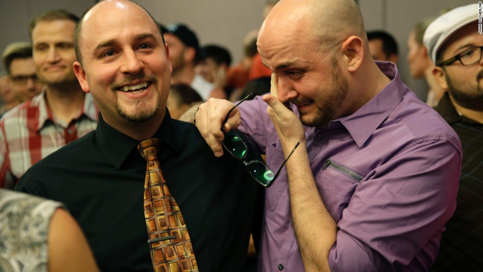 Joshua Gunter, right, and Bryan Shields attend a Las Vegas rally to celebrate an appeals court ruling that overturned Nevada&#39;s same-sex marriage ban on October 7, 2014.
