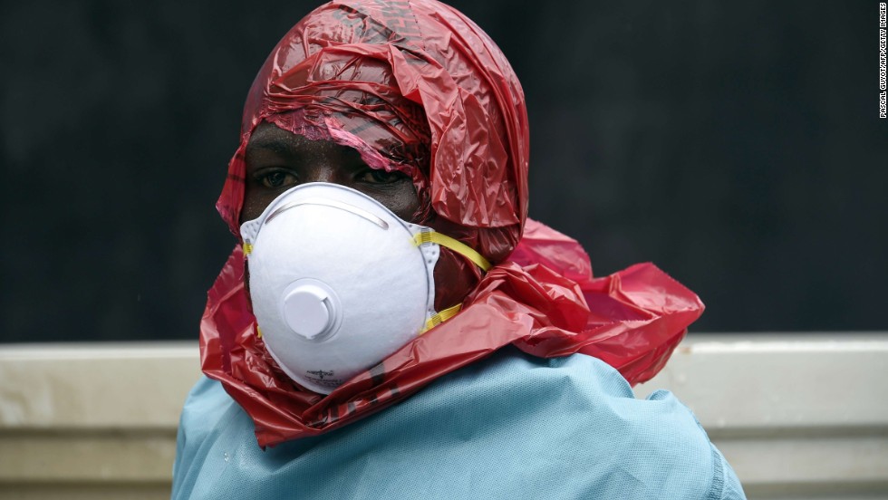 Most people in Ebola-affected areas do not have access to protective suits. Red Cross volunteers have improvised their protective wear and cover their heads with red plastic bags. They cut a hole in the bag to see and breathe.&lt;br /&gt;