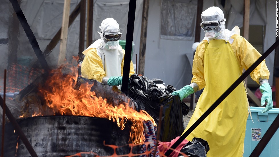 In Liberia, medical staff burn clothes belonging to Ebola patients to help stop the spread of the virus. 