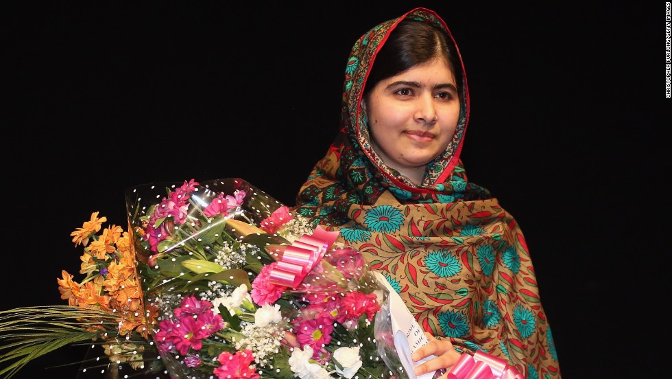Malala Yousafzai poses on stage in Birmingham, England, after she was announced as &lt;a href=&quot;http://www.cnn.com/2014/10/10/world/europe/nobel-peace-prize/index.html&quot;&gt;a recipient of the Nobel Peace Prize&lt;/a&gt; on Friday, October 10, 2014. Two years earlier, she was shot in the head by the Taliban for her efforts to promote education for girls in Pakistan. Since then, after recovering from surgery, she has taken her campaign to the world stage.