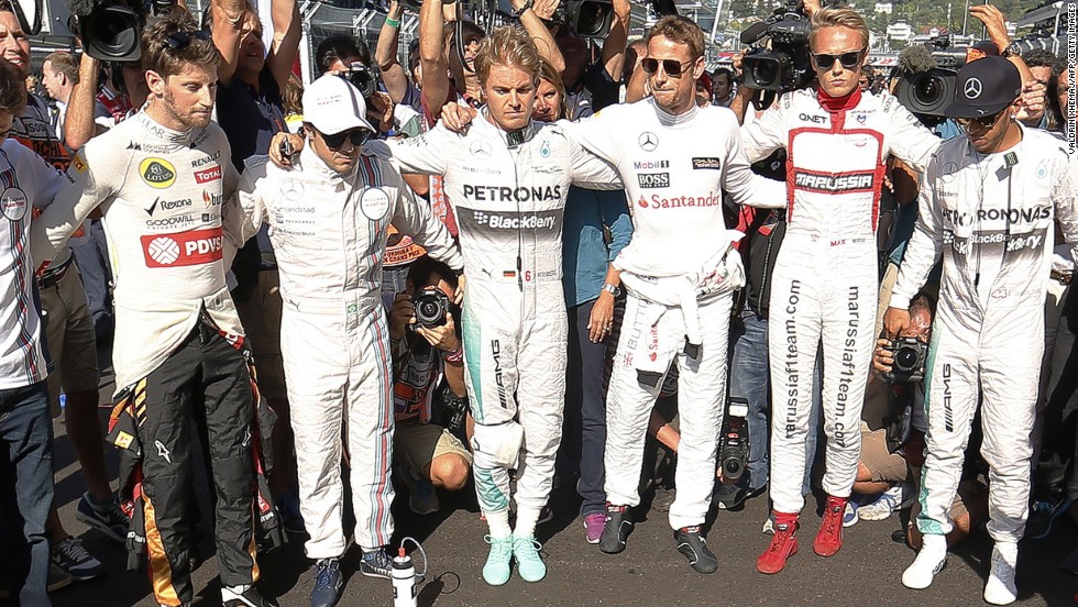 There were subdued scenes in Sochi as the F1 drivers held a minute&#39;s silence before the race in respect for Bianchi, who was in a French hospital at the time.