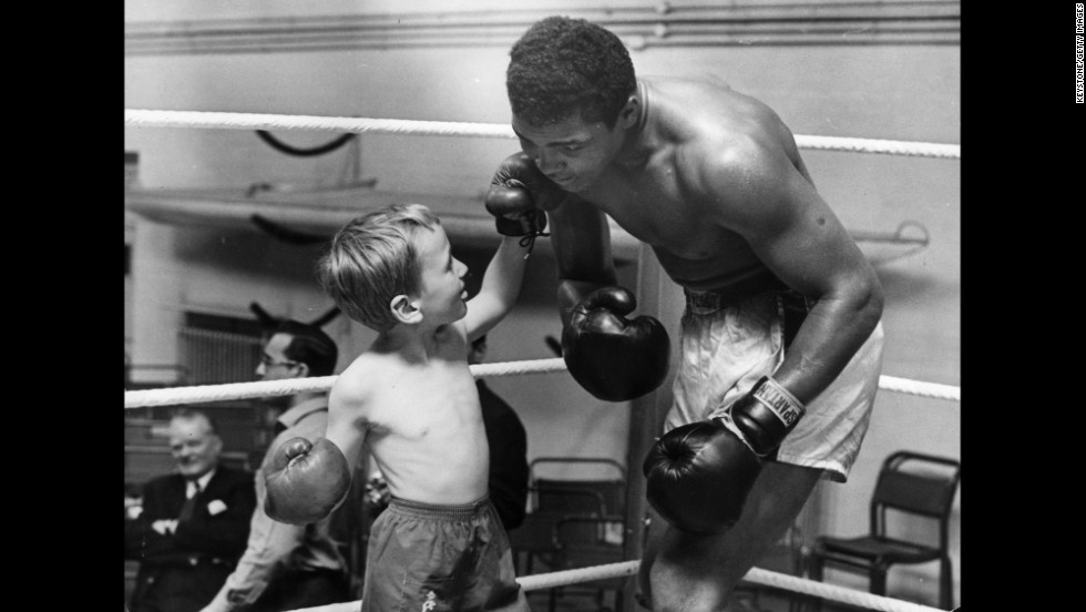 Patrick Power, 6, takes on Ali in the ring in 1963. Patrick was taking boxing lessons after getting bullied.