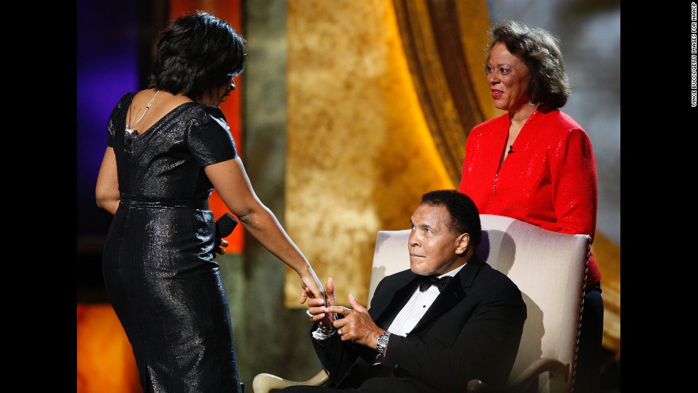 Ali&#39;s wife, Lonnie, watches as actress Alfre Woodard presents him with the President&#39;s Award during the 2009 NAACP Image Awards in Los Angeles.
