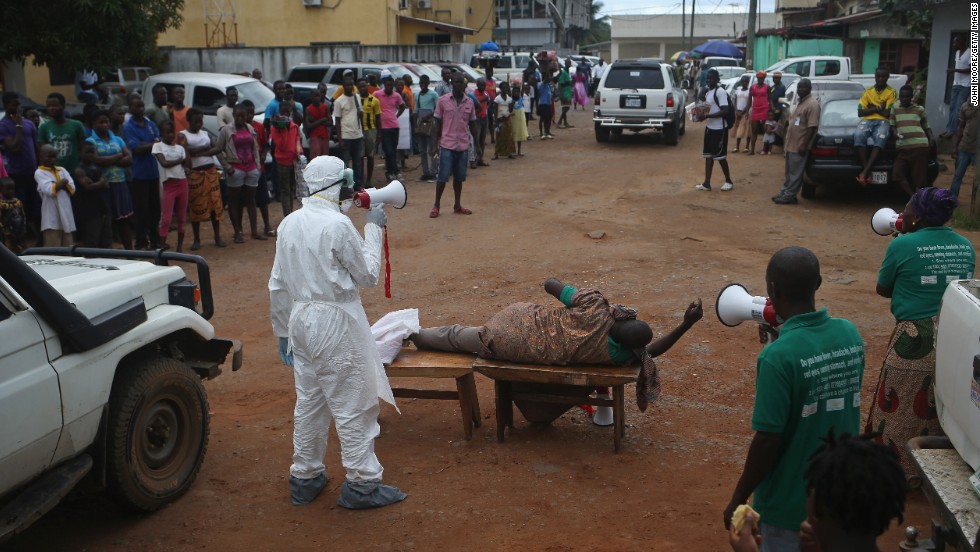 Aid workers from the Liberian Medical Renaissance League stage an Ebola awareness event October 15, 2014, in Monrovia. The group performs street dramas throughout Monrovia to educate the public on Ebola symptoms and how to handle people who are infected with the virus.