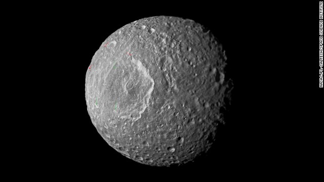This mosaic of Saturn&#39;s moon Mimas was created from images taken by NASA&#39;s Cassini spacecraft during its closest flyby of the moon in February 2010. A new study suggests that the moon is either shaped like a football or it contains a liquid water ocean.