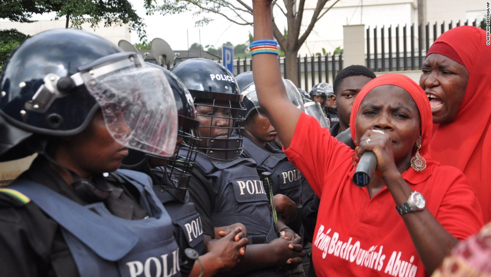 Police in riot gear block a route in Abuja, Nigeria, on Tuesday, October 14, during a demonstration calling on the Nigerian government to rescue schoolgirls kidnapped by the Islamist militant group Boko Haram. In April, more than 200 girls were abducted from their boarding school in northeastern Nigeria, officials and witnesses said.