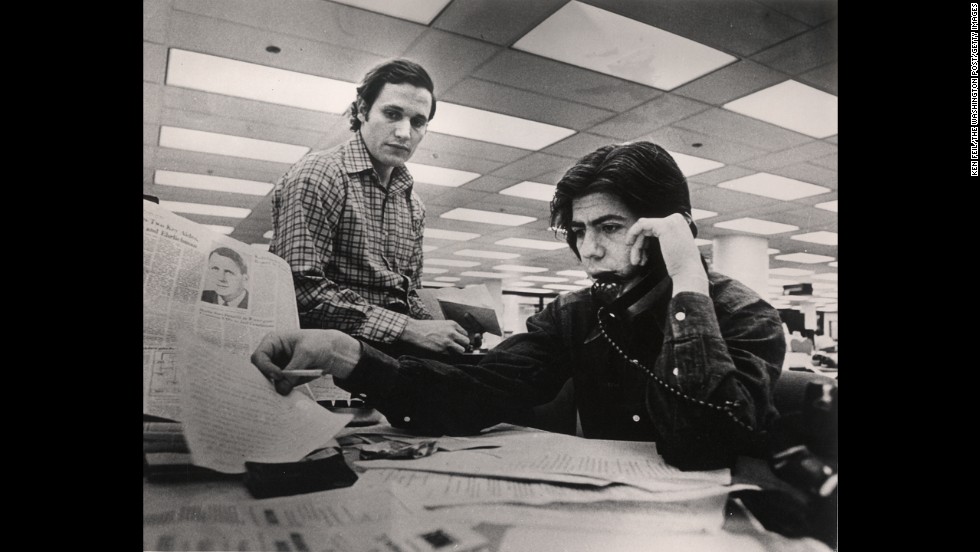 In April 1973, Woodward, left, and Bernstein work the Watergate story from the Washington Post newsroom.  