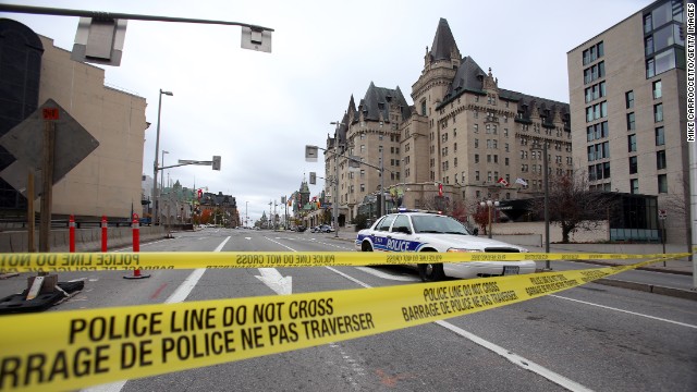Caption:OTTAWA, CANADA - OCTOBER 22: Police tape blocks Wellington St. at Sussex near the National War Memorial where a soldier was shot earlier in the day, just blocks away from Parliament Hill, on October 22, 2014 in Ottawa, Canada. Officials are investigating multiple reports of shootings and suspects after at least one gunman shot a Canadian soldier and then entered Canada&#39;s Parliament building. (Photo by Mike Carroccetto/Getty Images)

