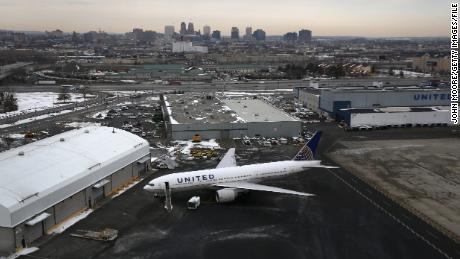 NEWARK, NJ - JANUARY 31: A United Airlines jet sits parked at Newark Liberty International Airport as seen from the window of a Customs and Border Protection (CBP), Blackhawk helicopter ahead of Super Bowl XLVIII on January 31, 2014 in Newark, New Jersey. Helicopters flown by 'air interdiction agents' from the CBP's Office of Air and Marine (OAM), are providing air support for Super Bowl XLVIII between the Denver Broncos and the Seattle Seahawks this Sunday. (Photo by John Moore/Getty Images)