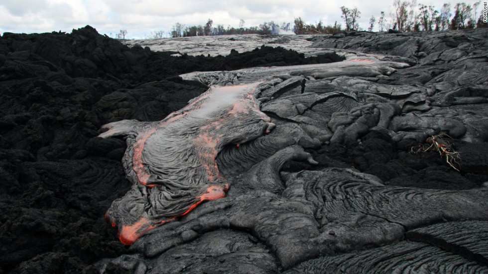 Lava flows from the Kilauea volcano in Pahoa, Hawaii, in October 2014. The flow picked up speed, prompting emergency officials to close part of the main road through town and tell residents to be prepared to evacuate.