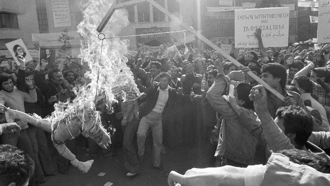 Demonstrators burn an effigy of Uncle Sam outside the U.S. Embassy in Tehran on November 13, 1979. They had gathered to show support for the Iranian militants who took over the embassy. The effigy was branded with &quot;CIA&quot; on its arm.