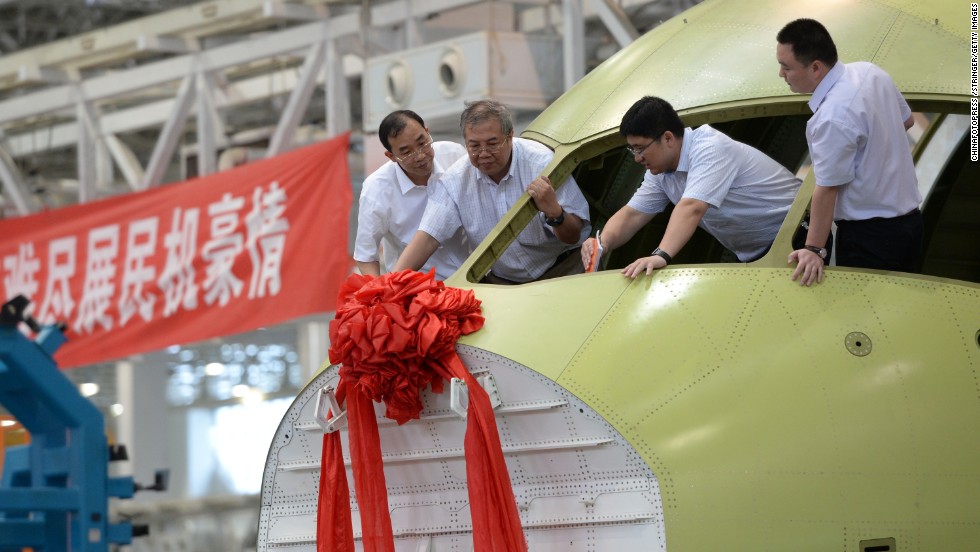 A new C919 airliner is celebrated on July 31 in Chengdu, China. The 168-seat C919, being built by the Shanghai-based Commercial Aircraft Corporation of China, is supposed to someday be the nucleus of a fleet of Chinese-built passenger aircraft.