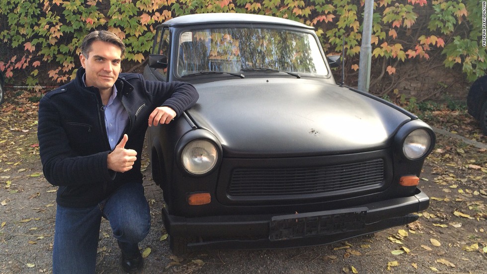 CNN&#39;s Frederik Pleitgen poses next to a Trabant, before it was painted and signed by thousands. The vehicle has been an icon to Germans ever since the tiny Communist-built cars started rolling across the border between what was then East and West Germany in 1989. 