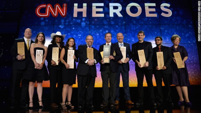 The 2014 CNN Heroes pose onstage during the 2014 CNN Heroes: An All Star Tribute at the American Museum of Natural History in New York City on Tuesday, November 18.