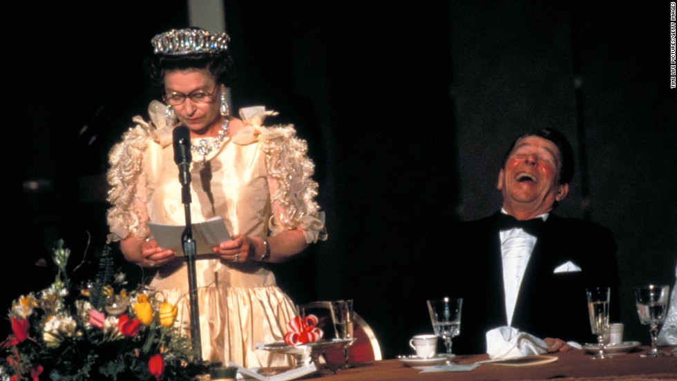 President Ronald Reagan laughing at the Queen&#39;s speech  during a state dinner in San Francisco, California in 1983.