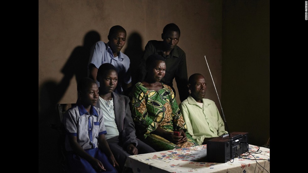 A family listens to the radio in Rwanda. A popular soap opera called &quot;Musekeweya,&quot; or &quot;New Dawn,&quot; is conveying a message of healing and reconciliation in the country, where more than 800,000 people were massacred two decades ago.