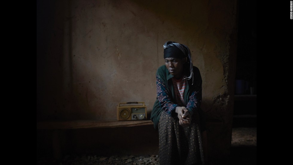 A woman in Rwanda listens to &quot;Musekeweya.&quot;