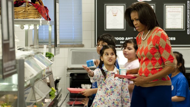 Then-first lady Michelle Obama in a school lunch line in the cafeteria at a Virginia elementary school in 2012.