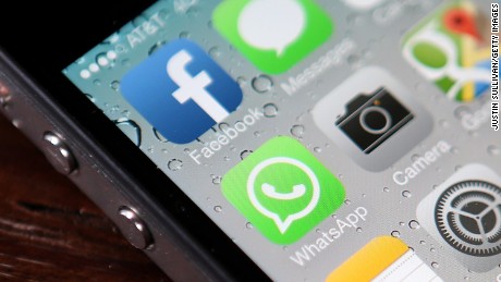 SAN FRANCISCO, CA - FEBRUARY 19:  The Facebook and WhatsApp app icons are displayed on an iPhone 5 on February 19, 2014 in San Francisco City.(Photo illustration by Justin Sullivan/Getty Images)