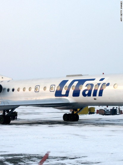 Passengers get out and push frozen plane