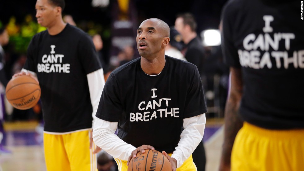 Los Angeles Lakers&#39; Kobe Bryant, center, warms up before an NBA basketball game against the Sacramento Kings on Tuesday, December 9, in Los Angeles. The team wore &quot;I Can&#39;t Breathe&quot; shirts during warm-ups in support of the family of Eric Garner. Since a grand jury declined to indict a New York police officer in the death of Garner, demonstrators across the country have taken to the streets to express their outrage. Garner, a 43-year-old asthmatic, died in July after he was put in a chokehold by the officer, Daniel Pantaleo.