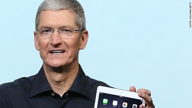 Apple CEO Tim Cook holds the new iPad Air 2 during a special event on October 16, 2014 in Cupertino, California. Apple unveiled the new iPad Air 2 tablet.