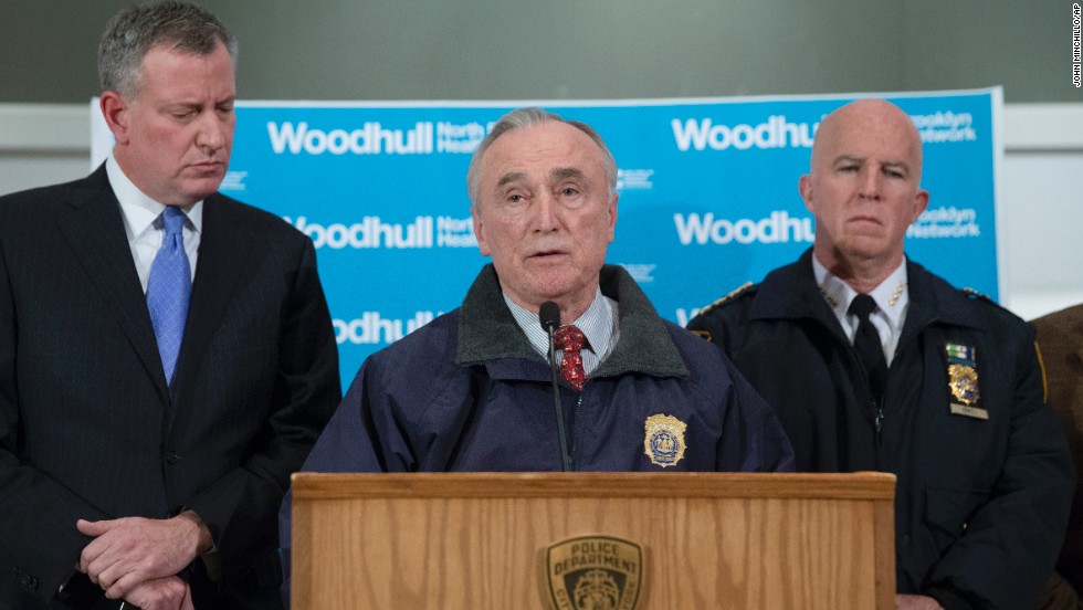 New York Police Department Commissioner Bill Bratton speaks alongside Mayor Bill de Blasio, left, and NYPD&#39;s Chief of Department James O&#39;Neill, right, during a news conference at Woodhull Medical Center on December 20. 