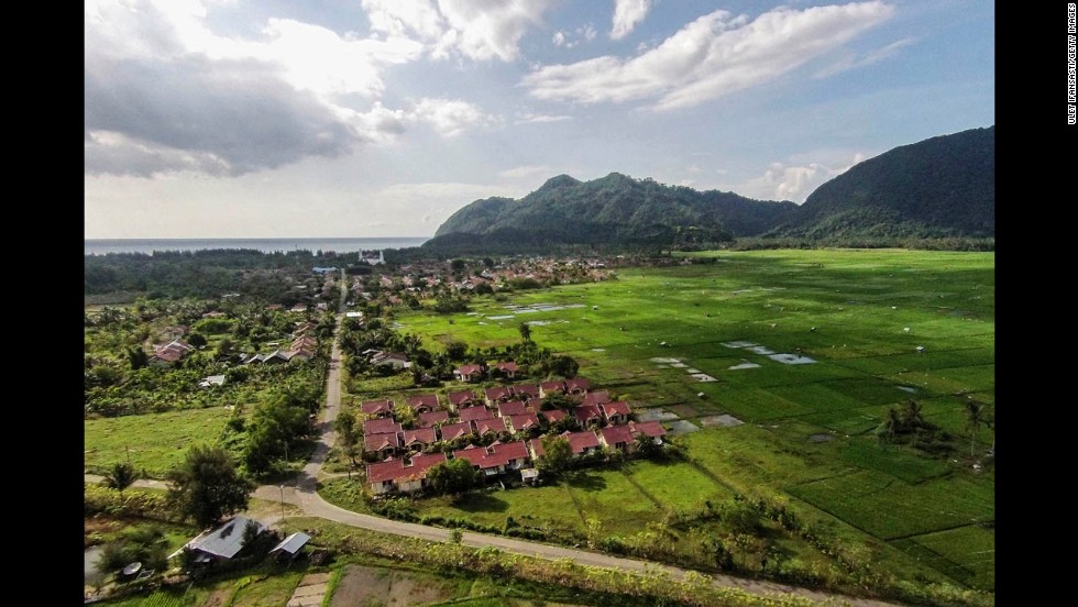 An aerial view of houses in Lampuuk, Banda Aceh, on December 11, 2014, shows the restoration of the coastline. 