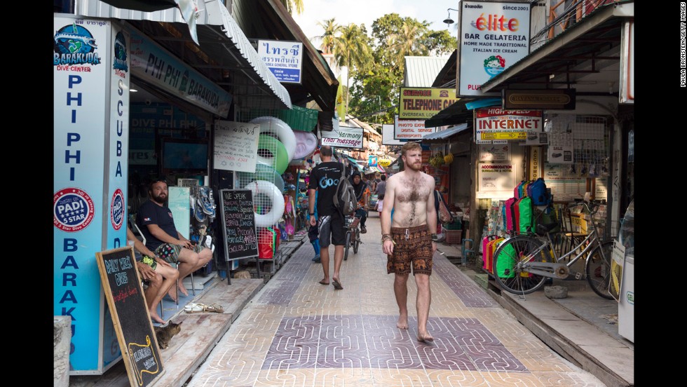 A decade later, people walk between stores in Phi Phi Village.