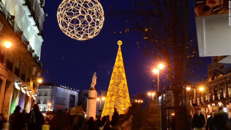 Bright Christmas decor adorns Puerto del Sol, a bustling square in &lt;a href=&quot;http://ireport.cnn.com/docs/DOC-1069767&quot;&gt;Madrid, Spain&lt;/a&gt;. 