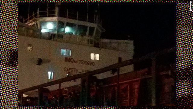 Crewless migrant ship docks safely