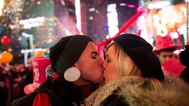 Angel Garcia and Rhea Coulson, of Florida, kiss at midnight as they celebrate the new year in Times Square in New York City.