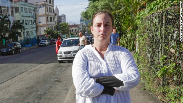 Cuban performance artist Tania Bruguera poses for a picture in a street of Havana, on December 31, 2014, upon her released from a police station. Bruguera was briefly released Wednesday but was re-arrested when she tried to go to Havana&#39;s main seaside avenue, the Malecon, to hold a press conference with other activists. Authorities had arrested Bruguera and 50 other dissidents yesterday to stop them from attending an open mic session convened by her at Revolution Square, an iconic plaza in front of Cuba&#39;s government headquarters, for Cubans to speak out about their future. The Cuban crackdown on dissident activists caused a new rift Wednesday with the United States, the first diplomatic scuffle since this month&#39;s historic announcement of a renewal in ties. AFP PHOTO / Adalberto ROQUE (Photo credit should read ADALBERTO ROQUE/AFP/Getty Images)