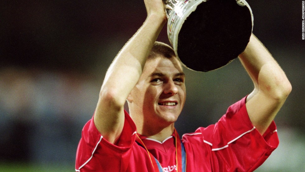 Gerrard holds aloft the UEFA Cup in 2001 after his goal in the final helped Liverpool overcome CD Alaves. The win saw Liverpool complete a &quot;treble,&quot; having won the League Cup earlier in the season and the FA Cup just days before.