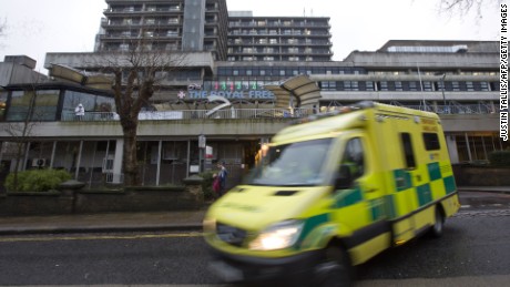 An ambulance pulls away from London&#39;s Royal Free Hospital where Scottish nurse Pauline Cafferkey is in serious but stable condition.