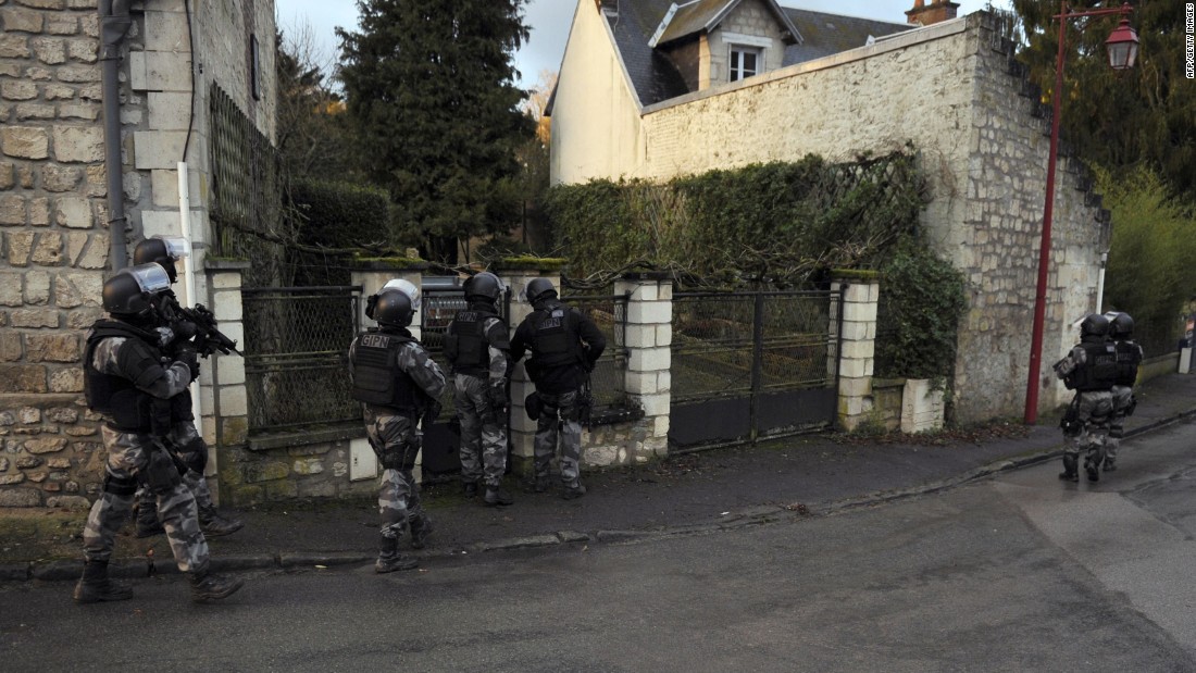 Members of the GIPN and RAID, French police special forces, walk in Corcy, northern France, on January 8, 2015 carry out searches as part of an investigation into a deadly attack the day before by armed gunmen on the Paris offices of French satirical weekly Charlie Hebdo. A huge manhunt for two brothers suspected of massacring 12 people in an Islamist attack at a satirical French weekly zeroed in on a northern town on January 8 after the discovery of one of the getaway cars. As thousands of police tightened their net, the country marked a rare national day of mourning for January 7&#39;s bloodbath at Charlie Hebdo magazine in Paris, the worst terrorist attack in France for half a century. AFP PHOTO / FRANCOIS LO PRESTIFRANCOIS LO PRESTI/AFP/Getty Images